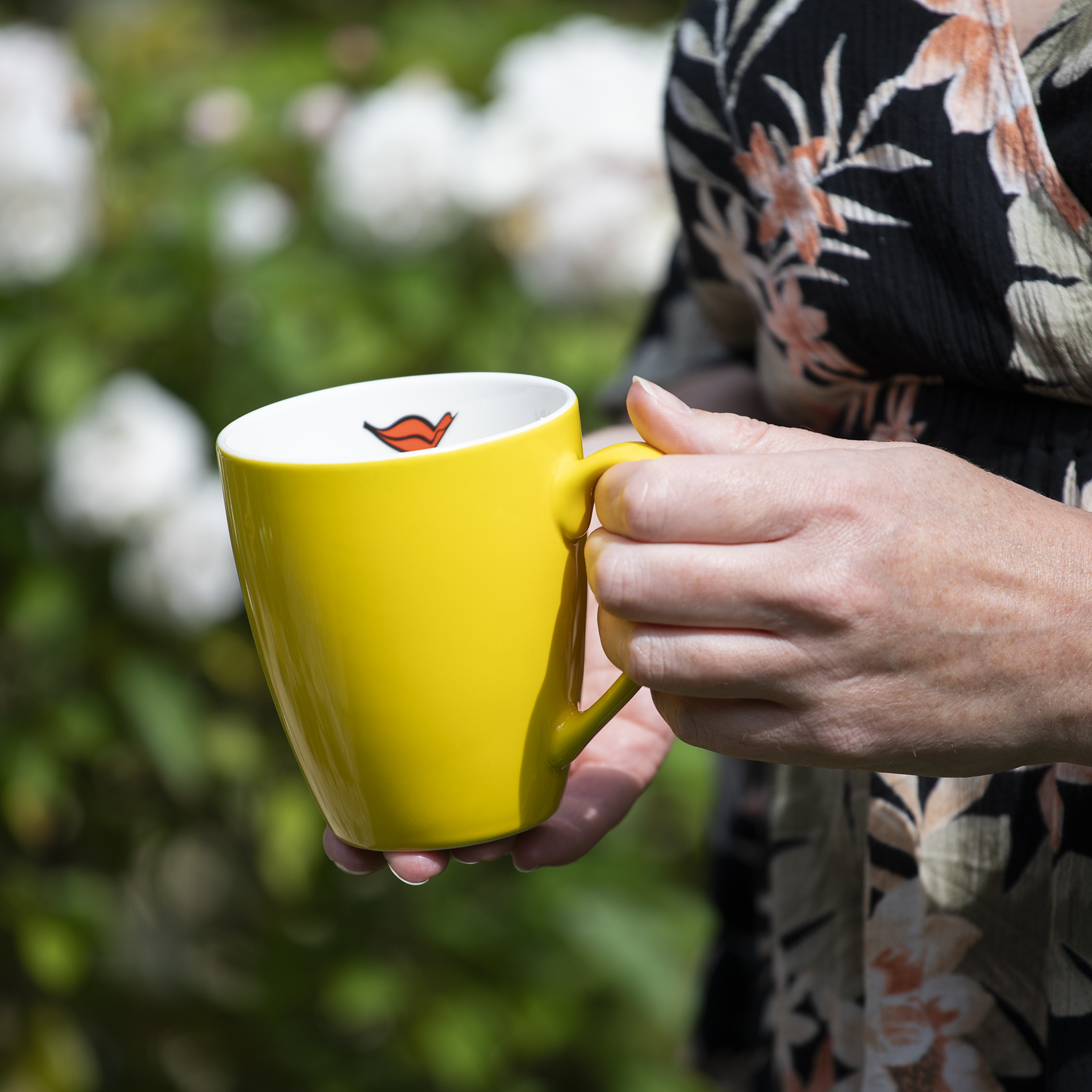 AIDA Kaffeetasse gelb mit Kussmund